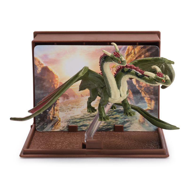 Kako izuriti svojega zmaja figurica s kartami v knjigi zmajev