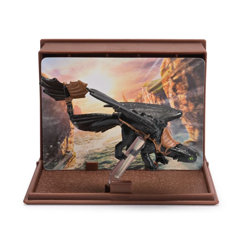 Kako izuriti svojega zmaja figurica s kartami v knjigi zmajev