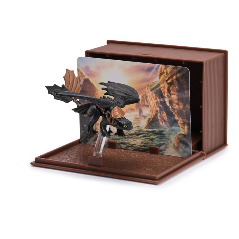 Kako izuriti svojega zmaja figurica s kartami v knjigi zmajev